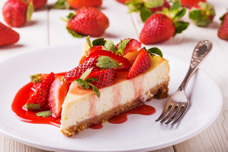 freepicdownloader.com delicious homemade cheesecake with strawberries white wooden table medium