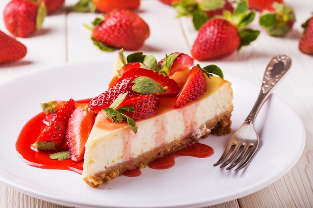 freepicdownloader.com delicious homemade cheesecake with strawberries white wooden table normal