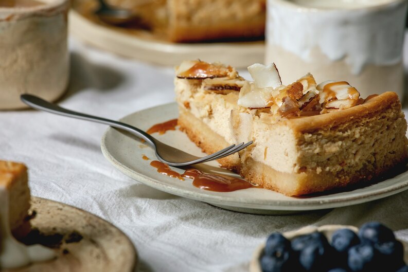 freepicdownloader.com piece cheesecake with coconut caramel medium
